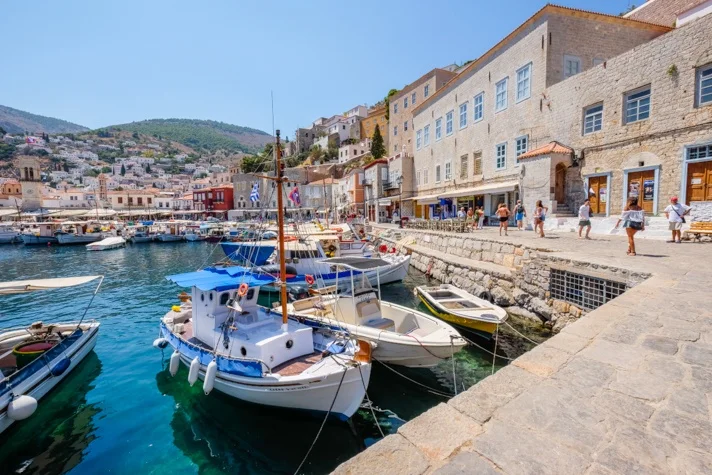 Small boats beside the stone waterfront of a Croatian island town